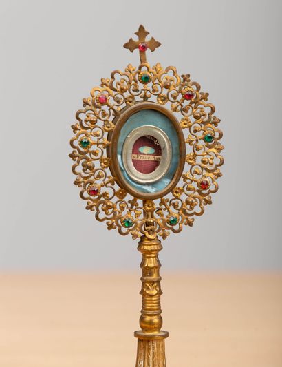 null Two reliquaries on brass and colored glass pedestals.
A small relic of Saint...