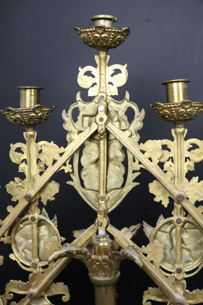 null Altar candlestick in bronze and gilded metal. 
It illuminates with five lights....