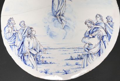 null NEVERS. 
Pair of circular earthenware plates with white glaze and blue decoration...