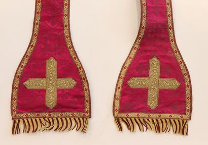 null Religious stole in red fabric decorated with foliage medallions. 
The braids...