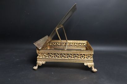 null Brass lectern with filigree cross decoration. 
The contour with decoration of...