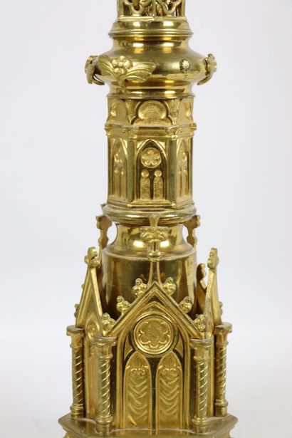 null Important gilded bronze candlestick with rich decoration of a gothic architecture.
The...