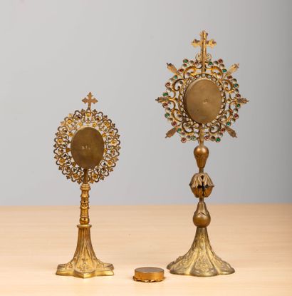 null Two reliquaries on brass and colored glass pedestals.
A small relic of Saint...