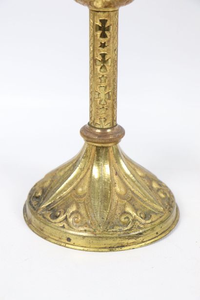 null Pair of gilded bronze candlesticks. 
The shaft ringed with stylized floral decoration....