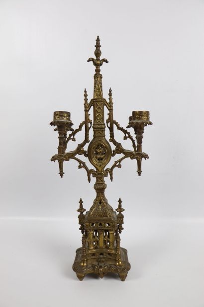 null Pair of gilt bronze candlesticks with gothic architecture decoration. 
They...