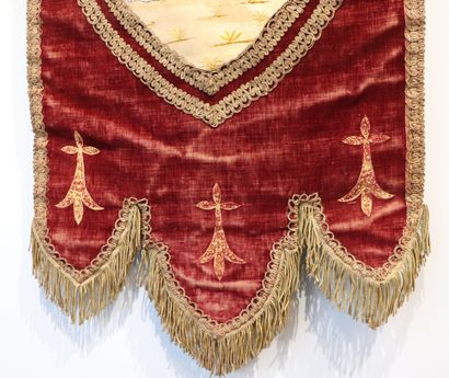 null Religious banner in red velvet decorated with an embroidered medallion showing...