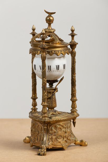null JEUNET inventor.
Gilt bronze revolving dial clock with opaline dial and Roman...