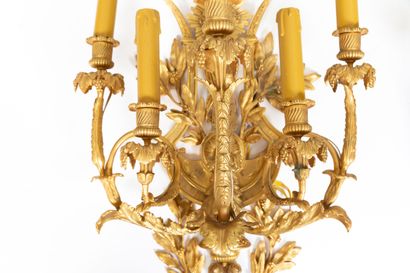 null Pair of large five-light ormolu sconces decorated with radiating female masks...