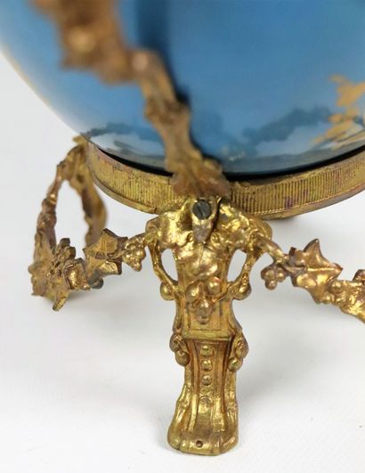 null SEVRES, in the taste of. 
A porcelain jardinière on an azure blue background.
The...