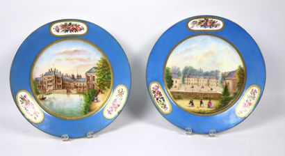 null SEVRES.
Reunion of two blue and gold porcelain plates with painted central decoration...