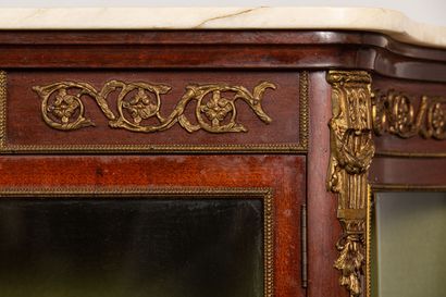 null A mahogany veneered display case with two glass doors, cambered legs and bronze...