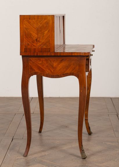 null Rosewood marquetry "bonheur-du-jour" desk with a décor of moving reserves in...