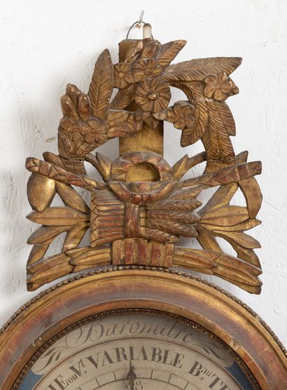 null Barometer in carved and gilded wood, after Toricelli.
The pediment features...