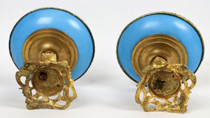 null SEVRES, in the taste of. 
Two porcelain footed bowls on an azure blue background.
The...