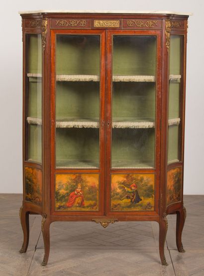 null A mahogany veneered display case with two glass doors, cambered legs and bronze...