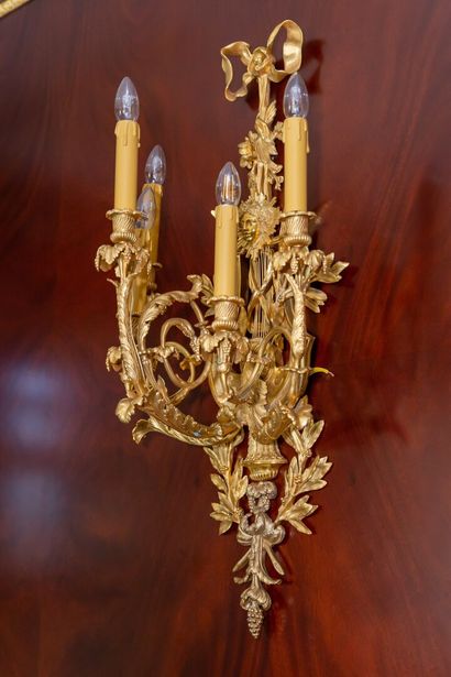 null Pair of large five-light ormolu sconces decorated with radiating female masks...