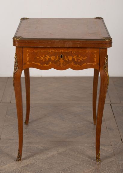 null Wood veneer and gilt bronze marquetry game table. 
Napoleon III period. 
H_77,5...