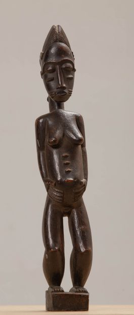 null Statuette féminine.
Peuple Baoulé, Côte d'Ivoire.
Bois.
H_35.5 cm.
Expert :...