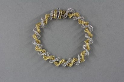 null Bracelet formé de deux chaines torsadées en or jaune et gris 18k, travail étranger,...