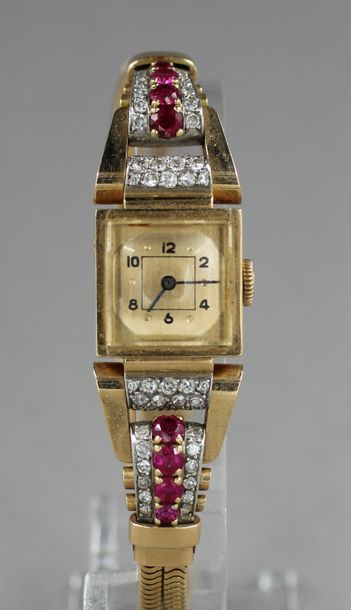 null Bracelet-montre de dame en or 18k, brillants et rubis, pds brut : 50,6 g. L...