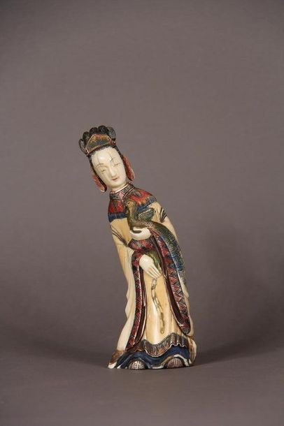 null Okimono in polychrome marine ivory representing a young woman holding a phoenix...