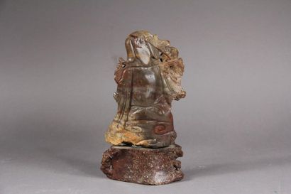 null Soapstone subject representing a crouching Luohan leaning on a stick.
China,...