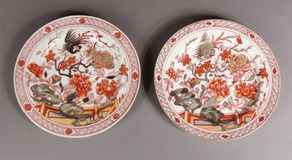 null Two porcelain plates with branch decoration with coral and gilded birds on a...