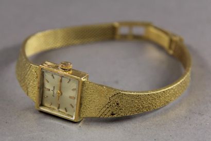 null EVIANA
Bracelet-montre de dame en or jaune 18k, pds brut : 30 g.
