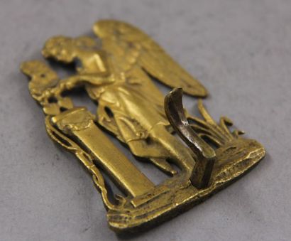 null Elément de porte-montre en bronze doré à décor d'Eros
H : 6 cm.