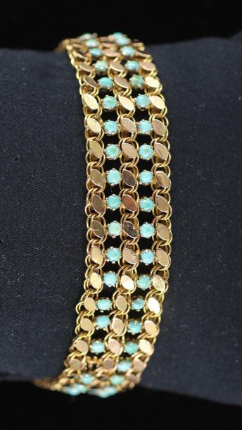 null Wide soft bracelet in 14k yellow gold and turquoise, weight : 20,9 g.