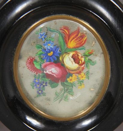 null 19th century school.
Bouquet of flowers
Fixed under oval glass in a blackened...