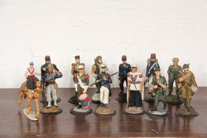 null Twelve legionnaires in painted polychrome tin, 1981. One legionary is attached...