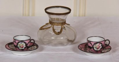 null Pair of porcelain doll's cups and saucers decorated with flowers on a pink background...