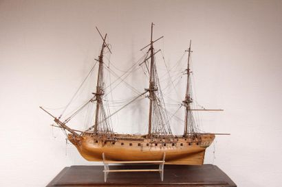 null Model of a wooden frigate of 18 in a harbour. It includes 26 18-guns below and...
