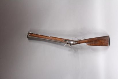 null Flintlock rifle called a blunderbuss. Round-bodied, lightly engraved lock. Damascus...