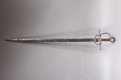 null Sword with horizontal quillons, three-stranded hilt and round pommel engraved...