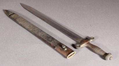  *Dagger in its leather sheath L: 56.5 cm. (accidents at the scabbard)