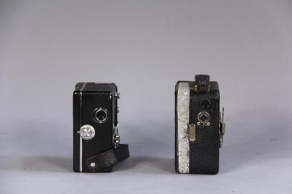 null *PATHE
Two cameras in their leather cases (wears)