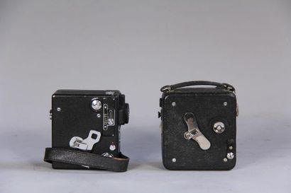 null *PATHE
Two cameras in their leather cases (wears)