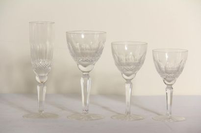 null *Glass service set on carved feet including 12 flutes, 12 water glasses, 12...