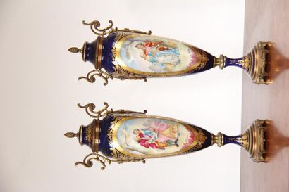 null *Pair of covered vases with two handles on pedestal in blue enamelled metal...
