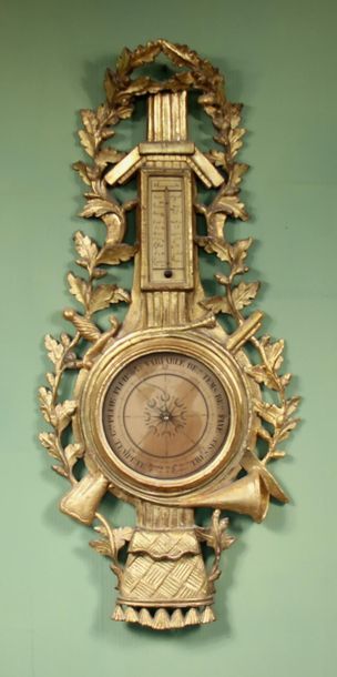 null Barometer-thermometer in gilded carved wood, 18th c.
100 x 48 cm. (accident...