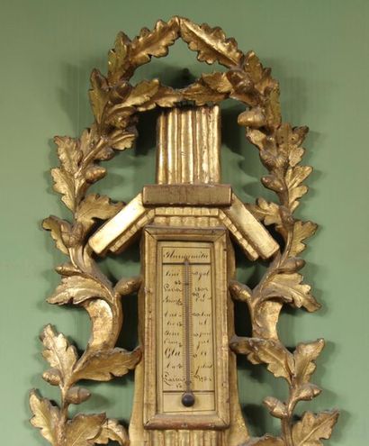 null Barometer-thermometer in gilded carved wood, 18th c.
100 x 48 cm. (accident...