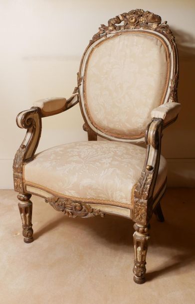 null Armchair in gilded wood and cream relaquered with medallion backrest in cabriolet....