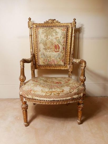 null Reddorated wooden armchair with trapezoid cabriolet back, flanked by detached...