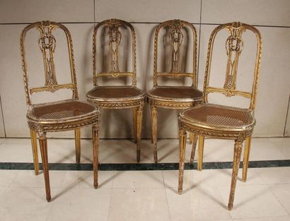 null Four caned chairs with straight openwork backrest in gilded wood (accidents,...