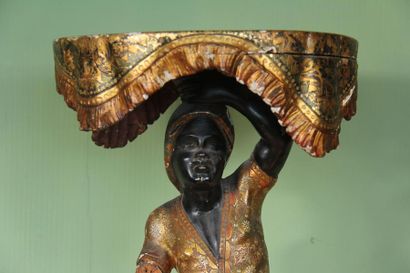 null Wooden polychrome saddle representing a young black man on a gondola holding...
