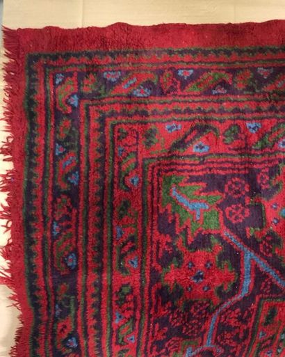 null A woollen rug with geometric decoration on a red background, Oushak, 
475 x...
