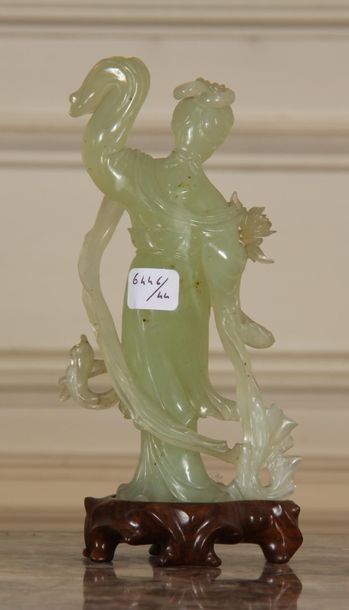 null Sculpture in jadeite representing a young woman holding a branch, base in natural...