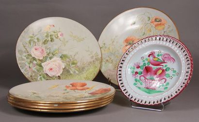 null Six polychrome earthenware plates decorated with flowers and figures FC.
Attached...